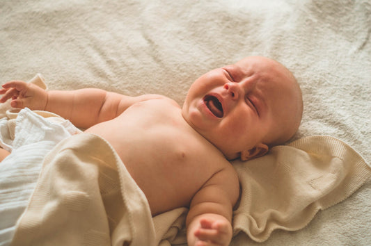 crying-baby-lying-bed