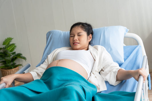 pregnant-woman-is-suffering-because-close-birth-lying-patient-bed